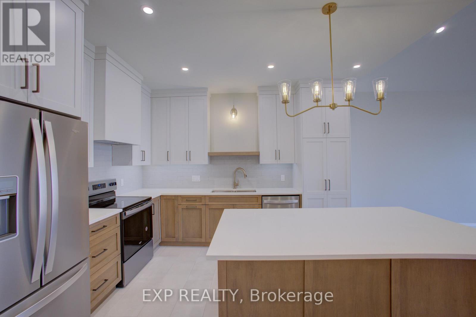 93 Bedell Drive, Mapleton, ON - Indoor Photo Showing Kitchen With Upgraded Kitchen