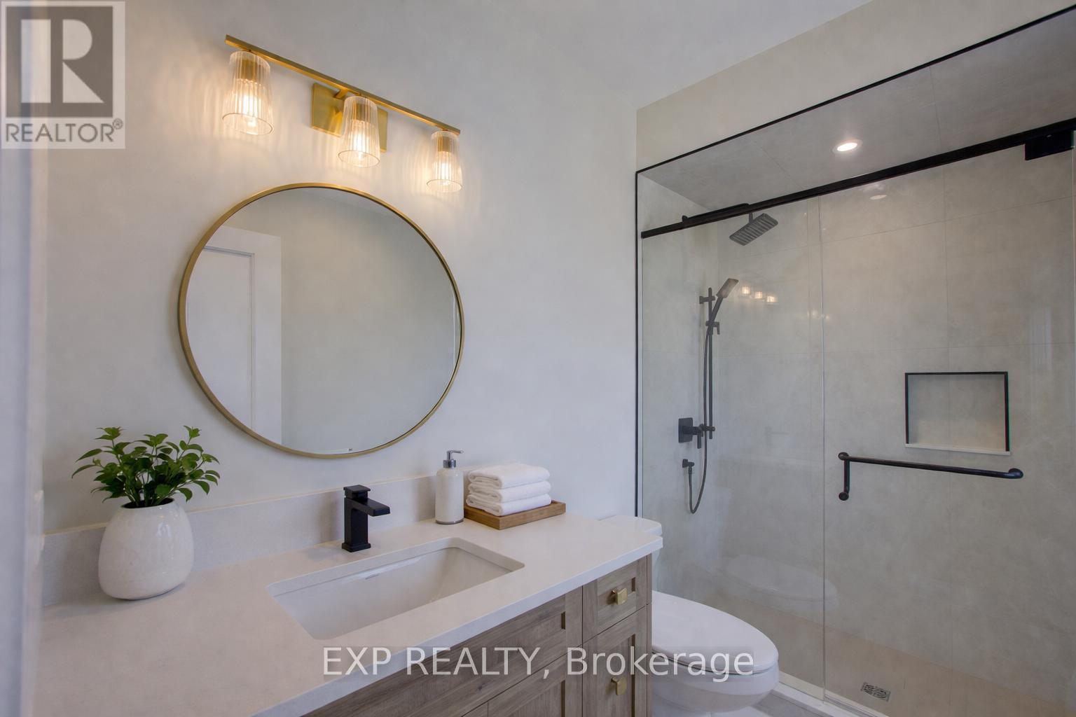 virtually staged - 93 Bedell Drive, Mapleton, ON - Indoor Photo Showing Bathroom