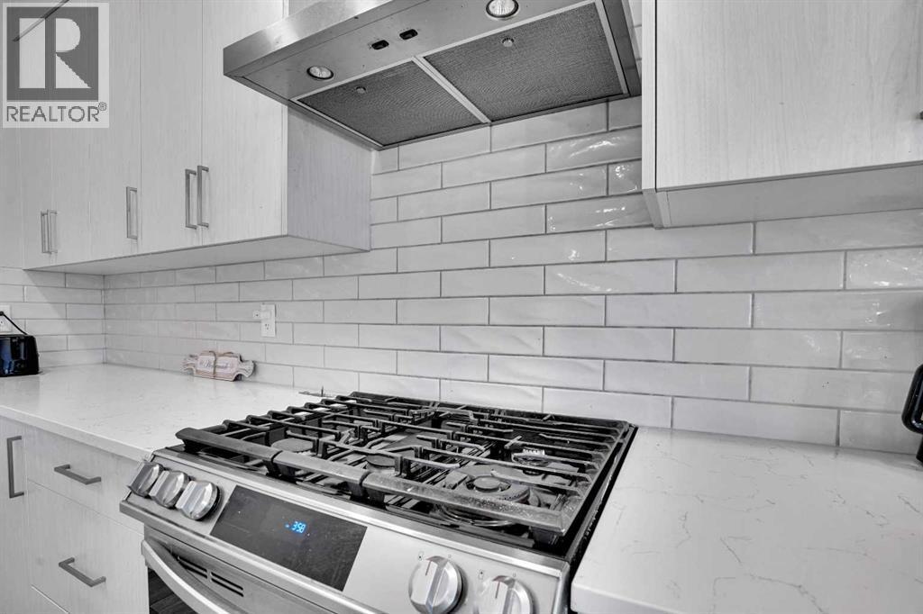 210 Lucas Close Nw, Calgary, AB - Indoor Photo Showing Kitchen With Stainless Steel Kitchen With Upgraded Kitchen