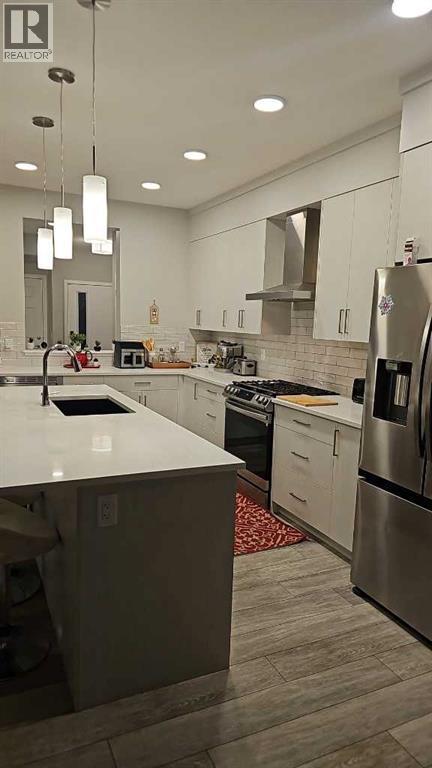 210 Lucas Close Nw, Calgary, AB - Indoor Photo Showing Kitchen With Stainless Steel Kitchen With Upgraded Kitchen