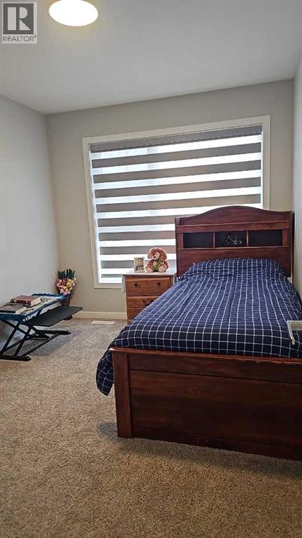 210 Lucas Close Nw, Calgary, AB - Indoor Photo Showing Bedroom