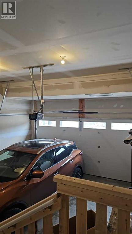 210 Lucas Close Nw, Calgary, AB - Indoor Photo Showing Garage