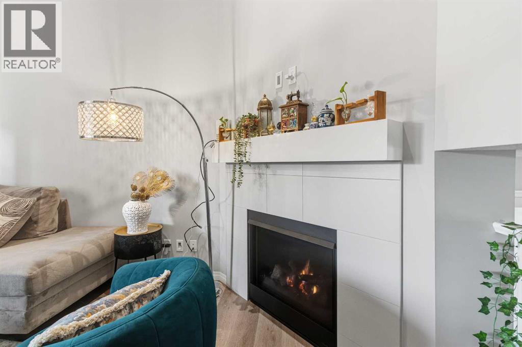 237 Windrow Crescent Sw, Airdrie, AB - Indoor Photo Showing Living Room With Fireplace