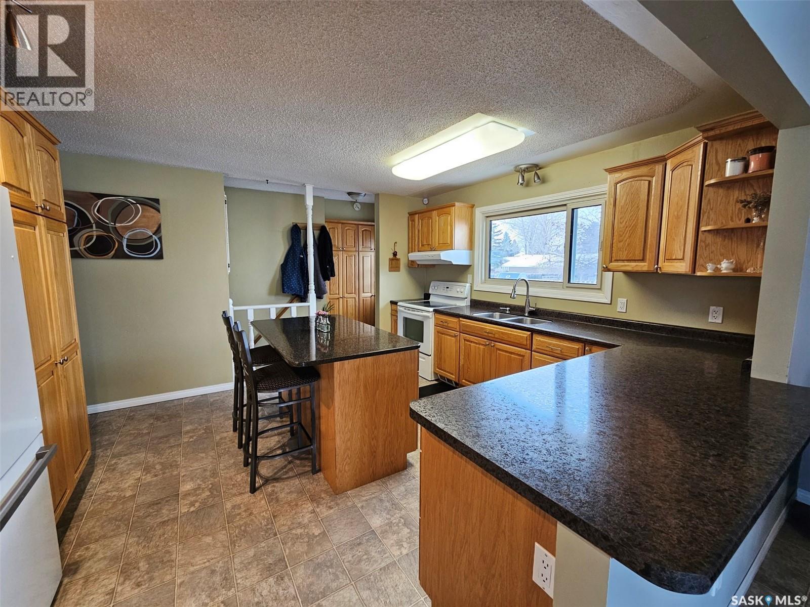 35 Mountain Drive, Carlyle, SK - Indoor Photo Showing Kitchen With Double Sink