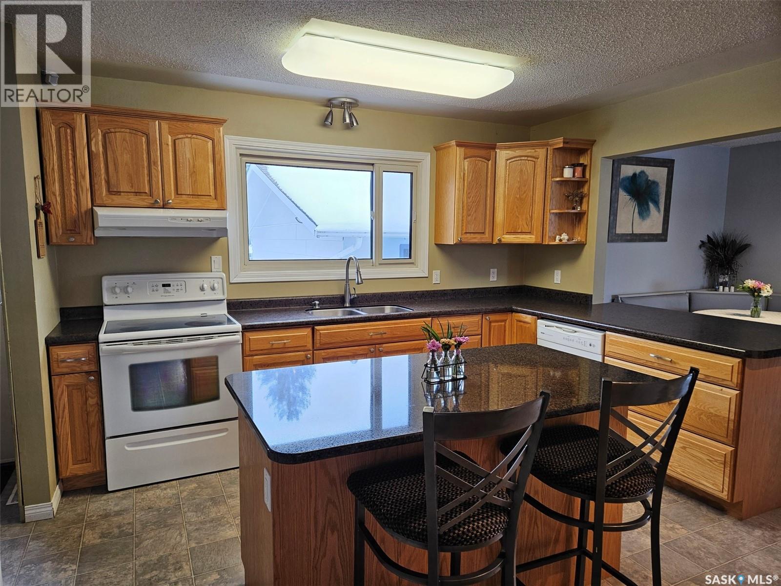 35 Mountain Drive, Carlyle, SK - Indoor Photo Showing Kitchen With Double Sink