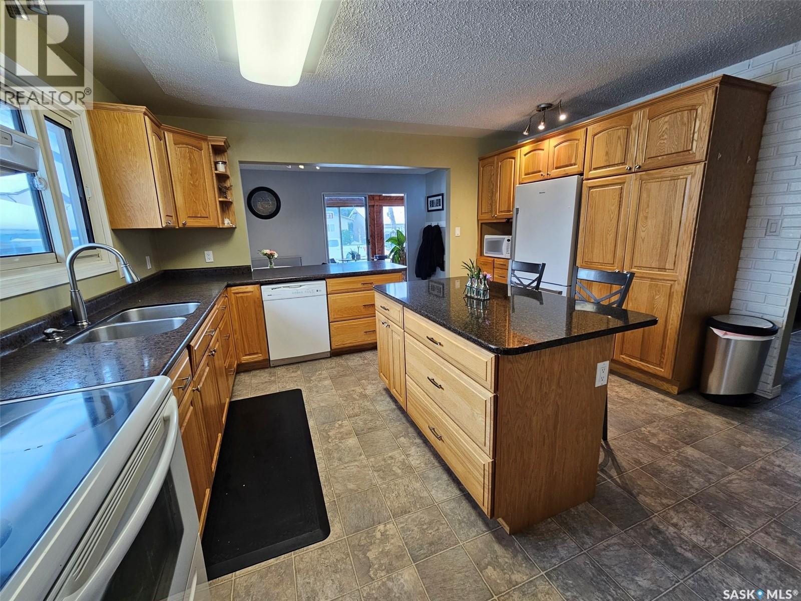 35 Mountain Drive, Carlyle, SK - Indoor Photo Showing Kitchen With Double Sink