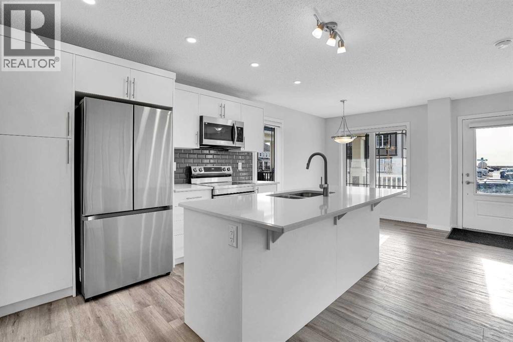 408 Windbury Link Sw, Airdrie, AB - Indoor Photo Showing Kitchen With Stainless Steel Kitchen With Upgraded Kitchen