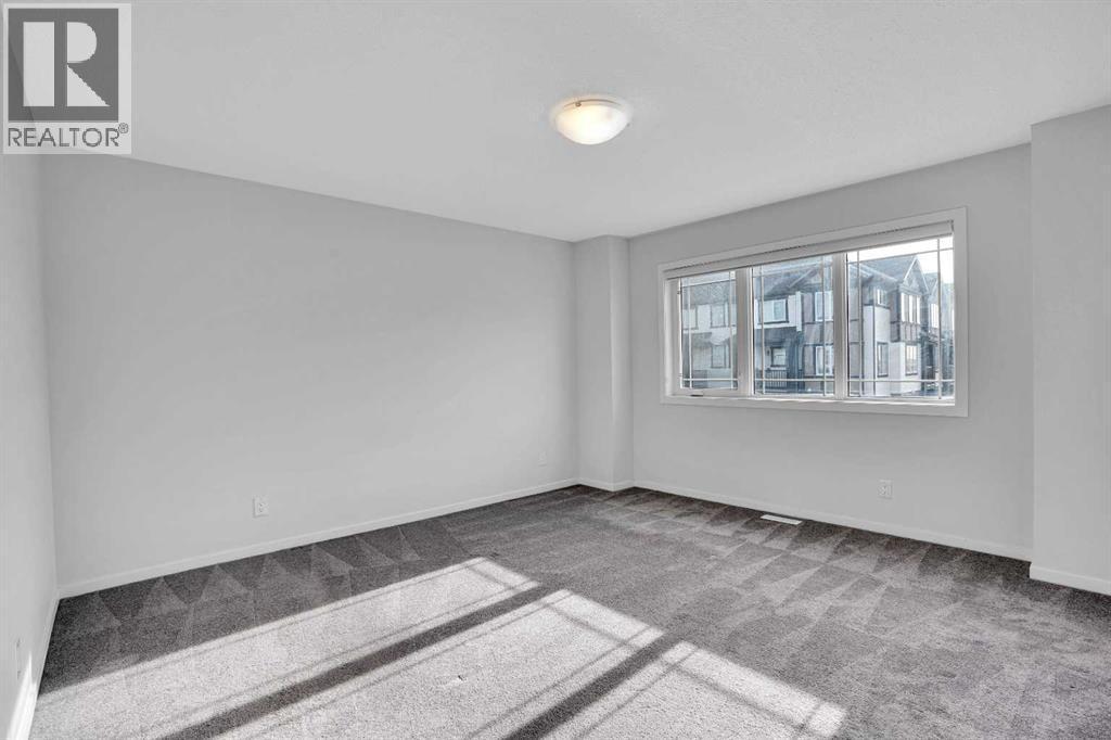 Primary Bedroom - 408 Windbury Link Sw, Airdrie, AB - Indoor Photo Showing Other Room