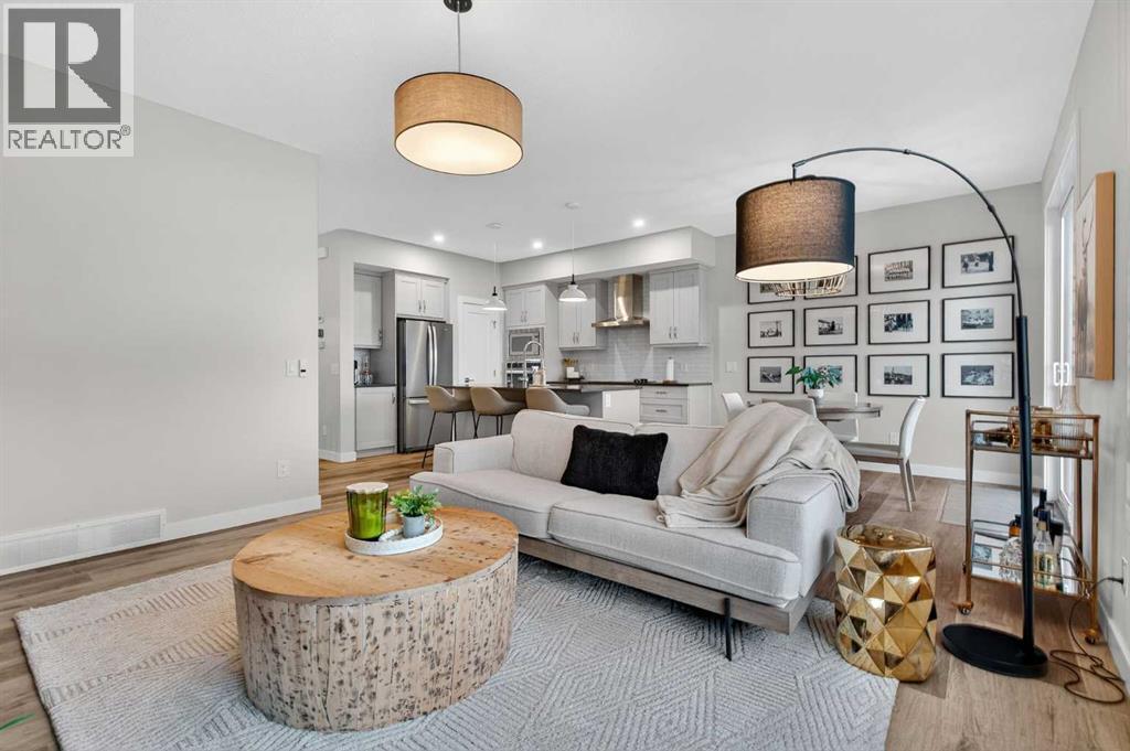 A cozy and warm living room blends functionality with design - 307 Precedence Hill, Cochrane, AB - Indoor Photo Showing Living Room