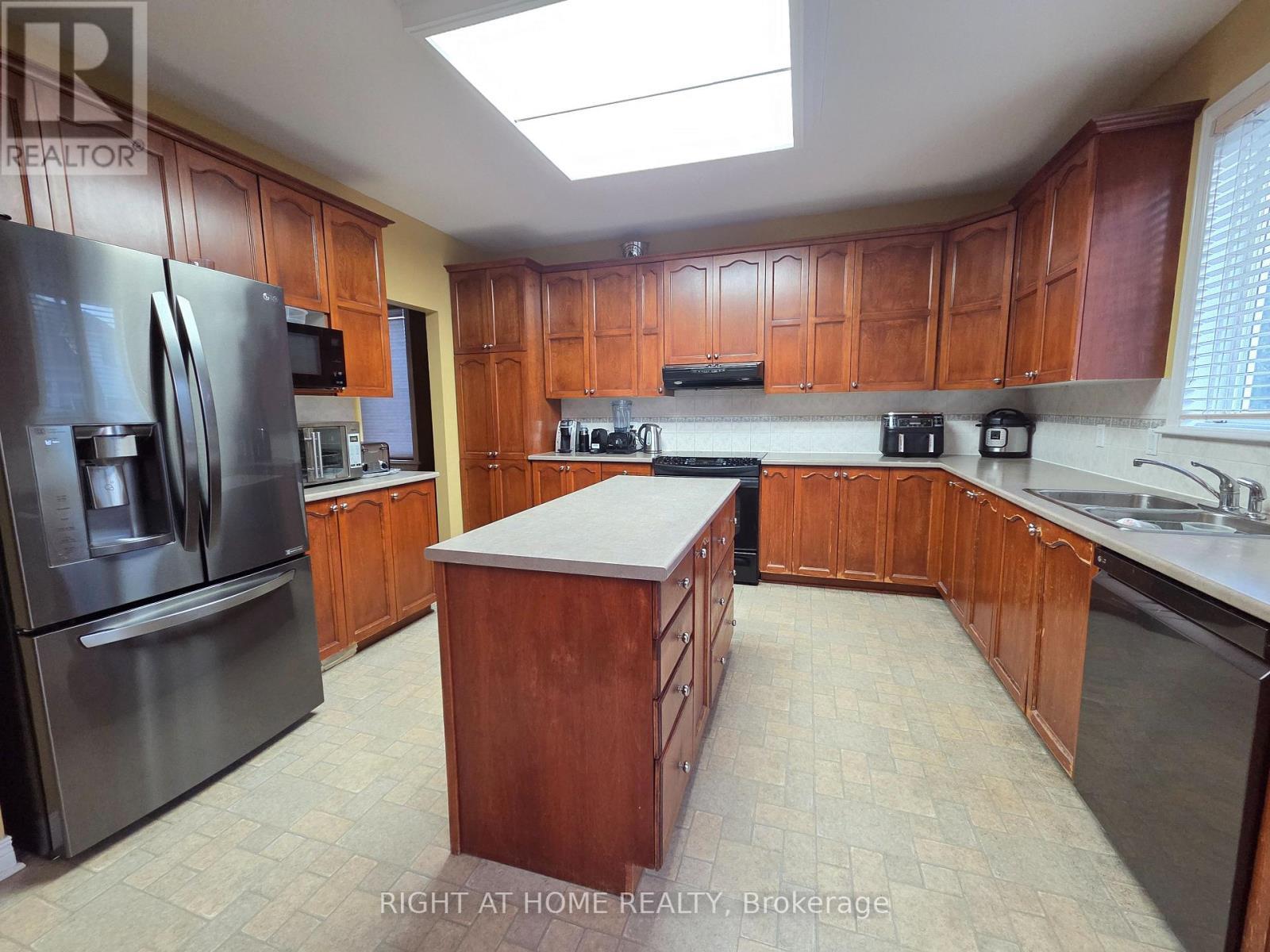 Kitchen with lots of cabinets & huge island - 96 Maple Stand Way, Ottawa, ON - Indoor Photo Showing Kitchen With Double Sink