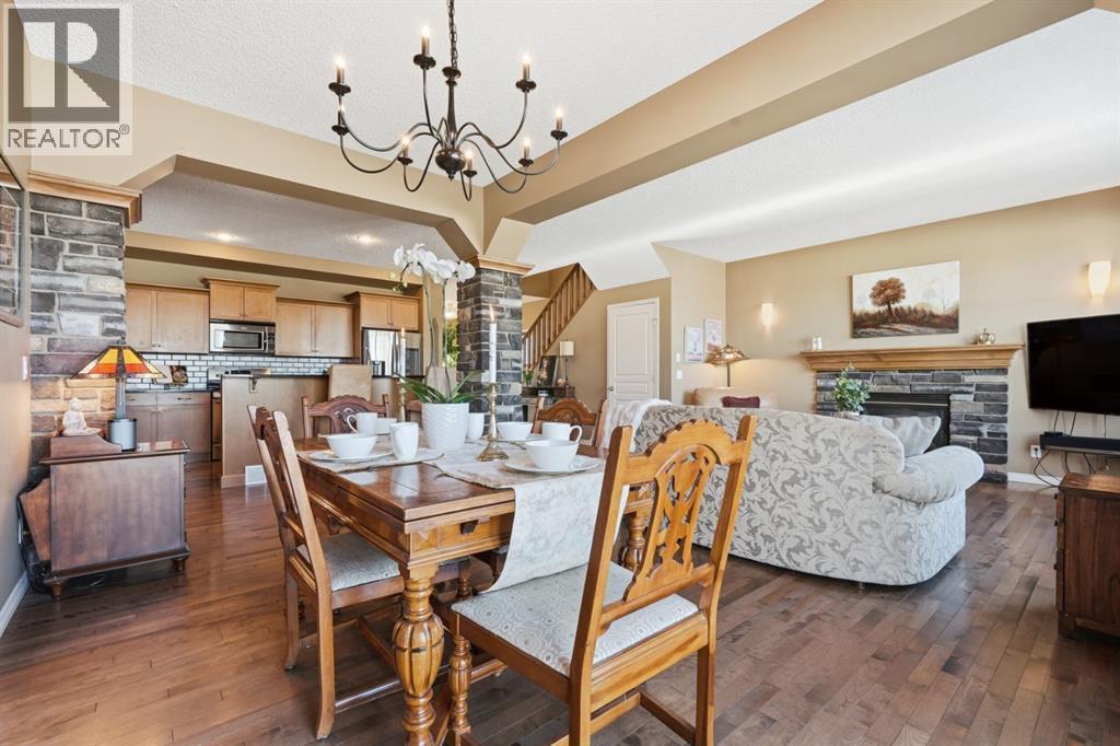 166 Cranridge Terrace Se, Calgary, AB - Indoor Photo Showing Dining Room With Fireplace