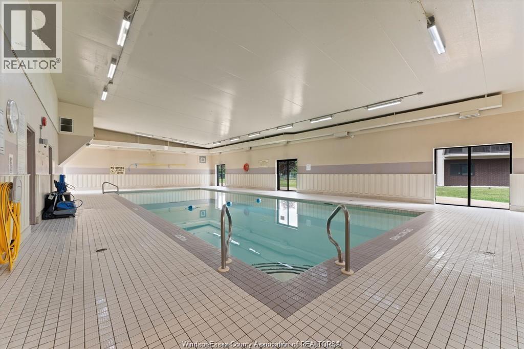 9099 Riverside Drive East Unit# E1017, Windsor, ON - Indoor Photo Showing Other Room With In Ground Pool