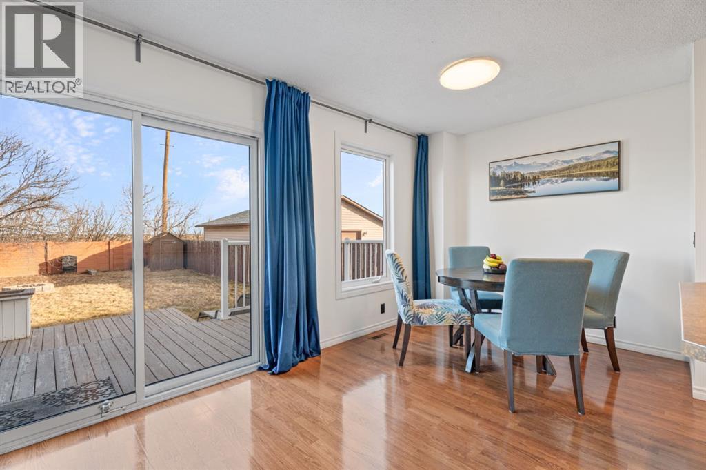 dining room and patio doors to backyard - 164 Beddington Circle Ne, Calgary, AB - Indoor Photo Showing Dining Room