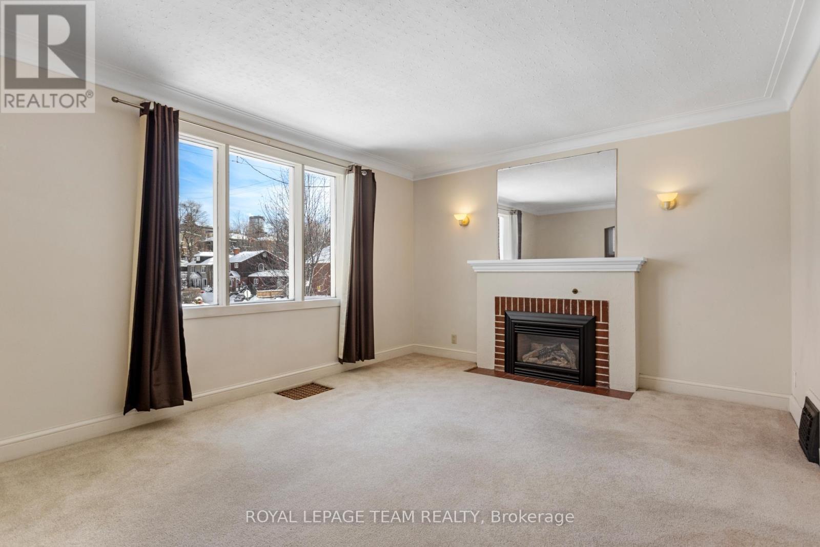 242 Fairmont Avenue, Ottawa, ON - Indoor Photo Showing Living Room With Fireplace