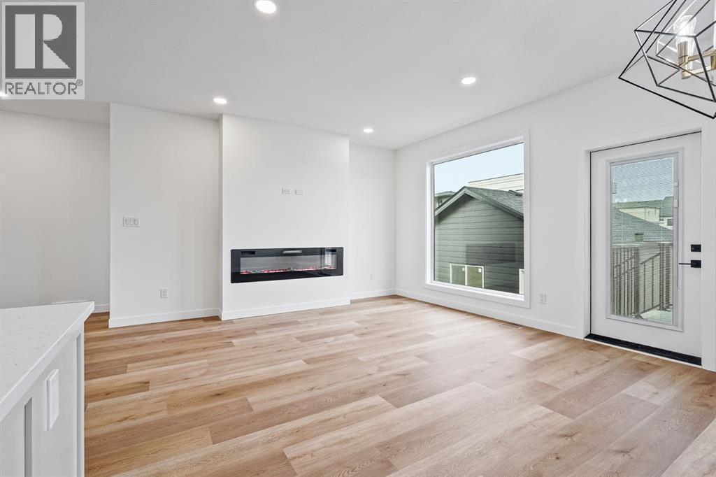 383 Caledonia Boulevard W, Lethbridge, AB - Indoor With Fireplace