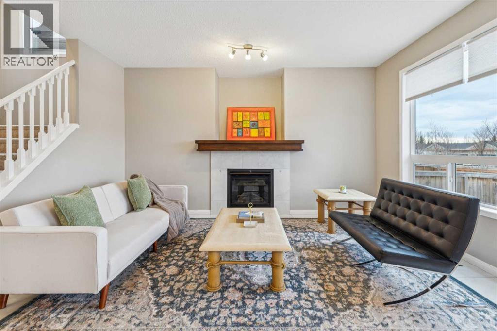 71 Walden Manor Se, Calgary, AB - Indoor Photo Showing Living Room With Fireplace
