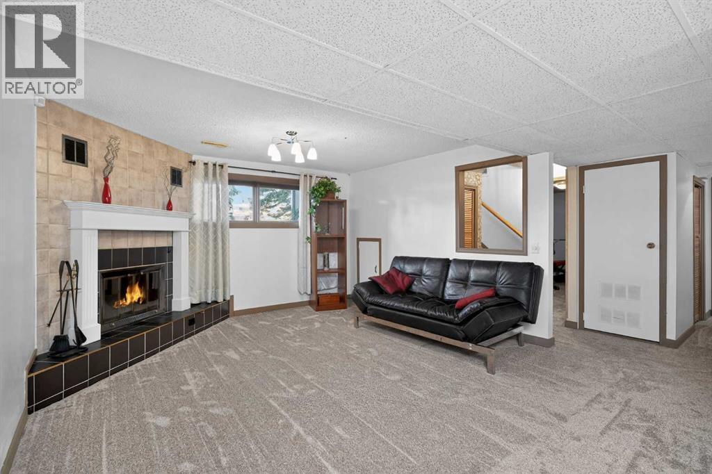 16 Rundleson Way Ne, Calgary, AB - Indoor Photo Showing Other Room With Fireplace