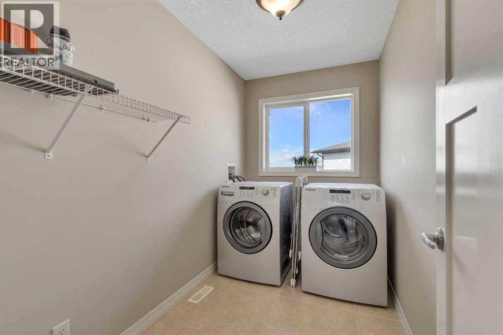 224 Panamount Point Nw, Calgary, AB - Indoor Photo Showing Laundry Room