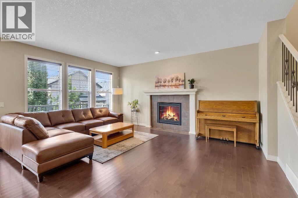 224 Panamount Point Nw, Calgary, AB - Indoor Photo Showing Living Room With Fireplace