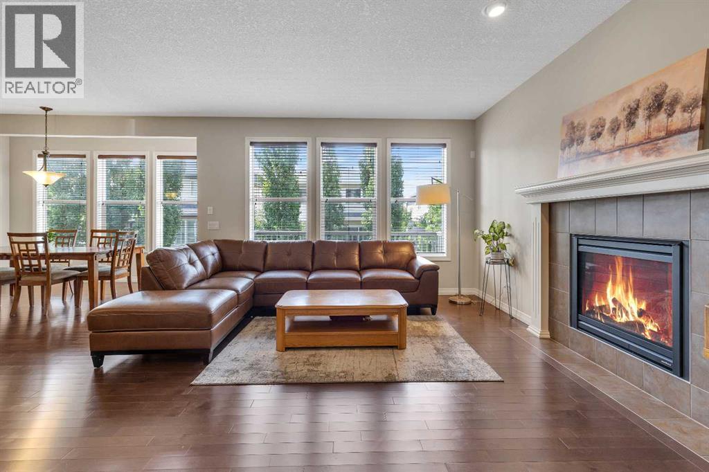 224 Panamount Point Nw, Calgary, AB - Indoor Photo Showing Living Room With Fireplace