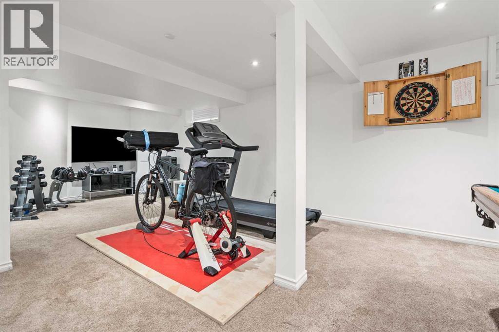 43 Sunset Crescent, Okotoks, AB - Indoor Photo Showing Gym Room