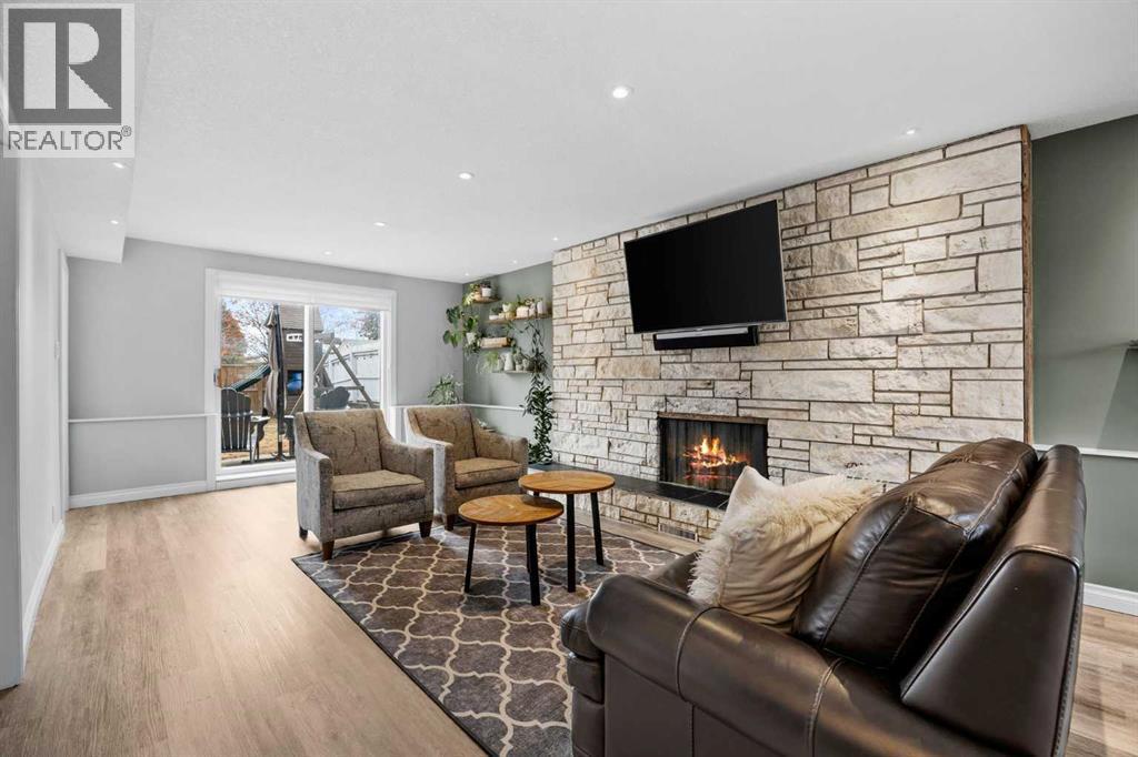 123 Sackville Drive Sw, Calgary, AB - Indoor Photo Showing Living Room With Fireplace