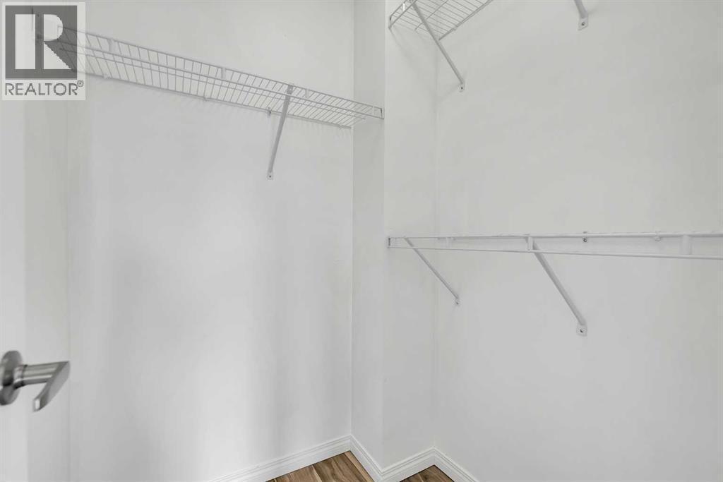 walk-in closet - 169 Windstone Park Sw, Airdrie, AB - Indoor With Storage