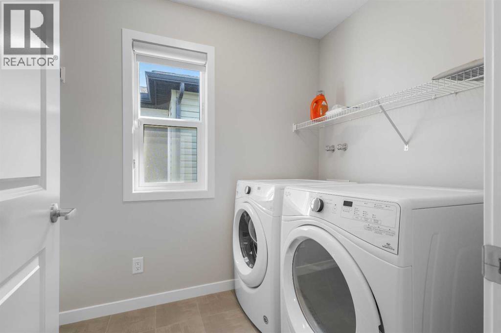 33 Walcrest Way Se, Calgary, AB - Indoor Photo Showing Laundry Room