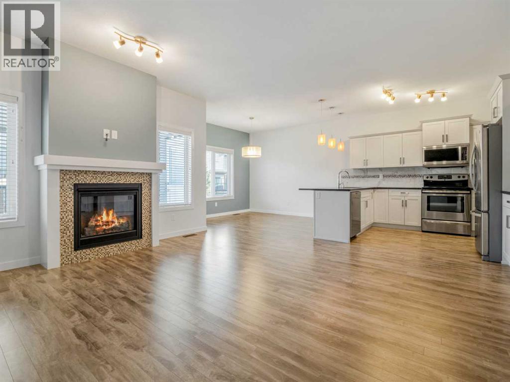 98 Moonlight Boulevard W, Lethbridge, AB - Indoor With Fireplace