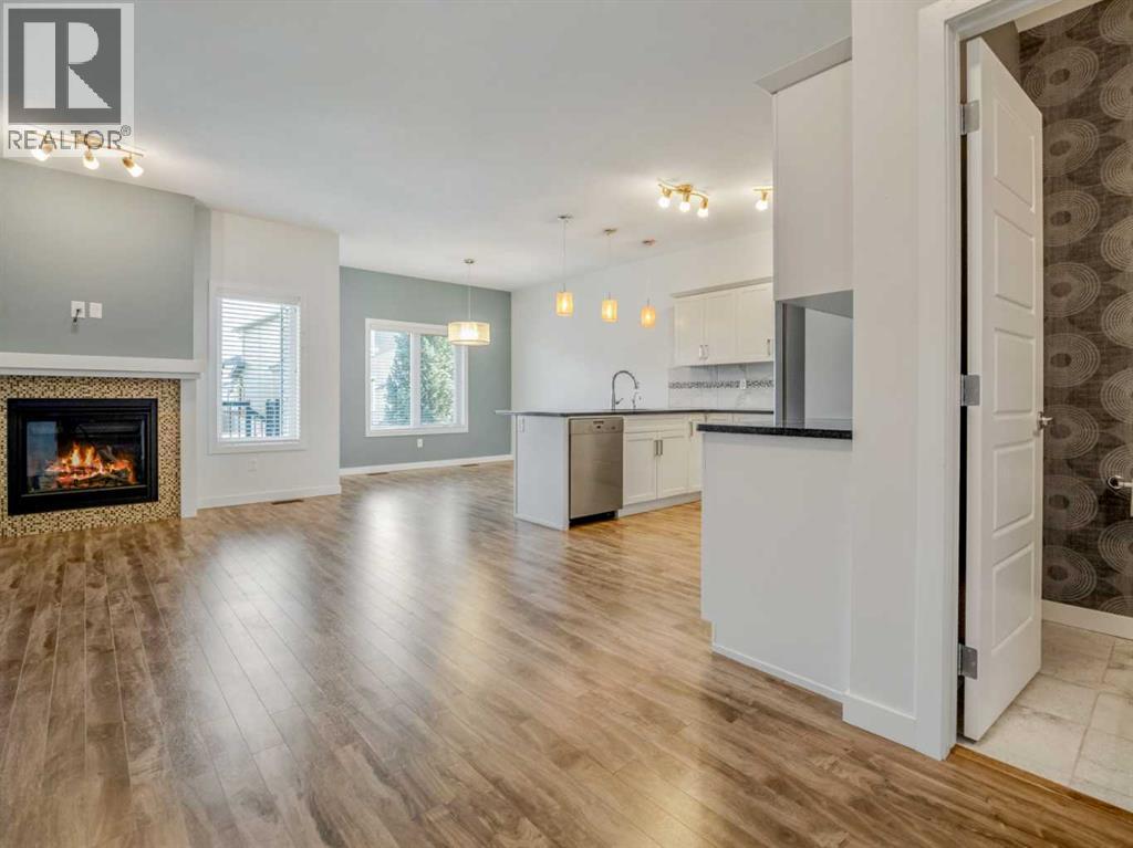98 Moonlight Boulevard W, Lethbridge, AB - Indoor Photo Showing Living Room With Fireplace