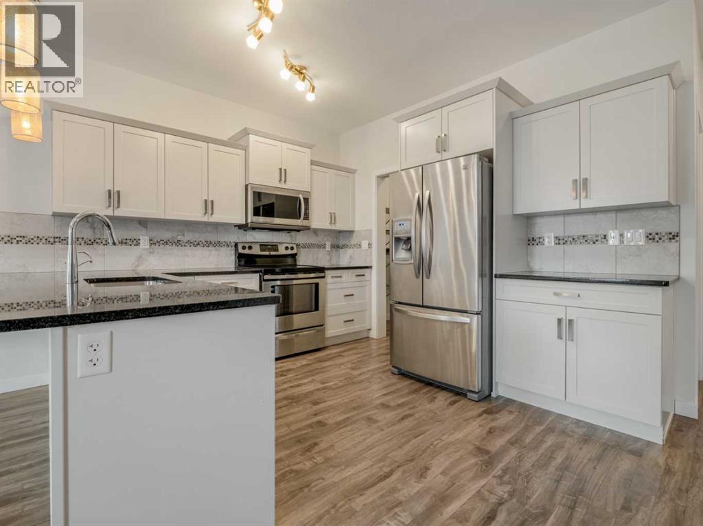 98 Moonlight Boulevard W, Lethbridge, AB - Indoor Photo Showing Kitchen With Stainless Steel Kitchen With Double Sink