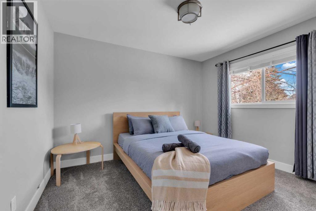 19 Garrick Drive Sw, Calgary, AB - Indoor Photo Showing Bedroom