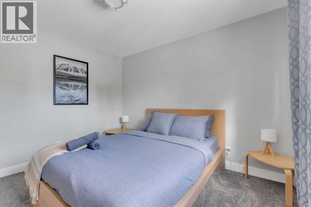 19 Garrick Drive Sw, Calgary, AB - Indoor Photo Showing Bedroom