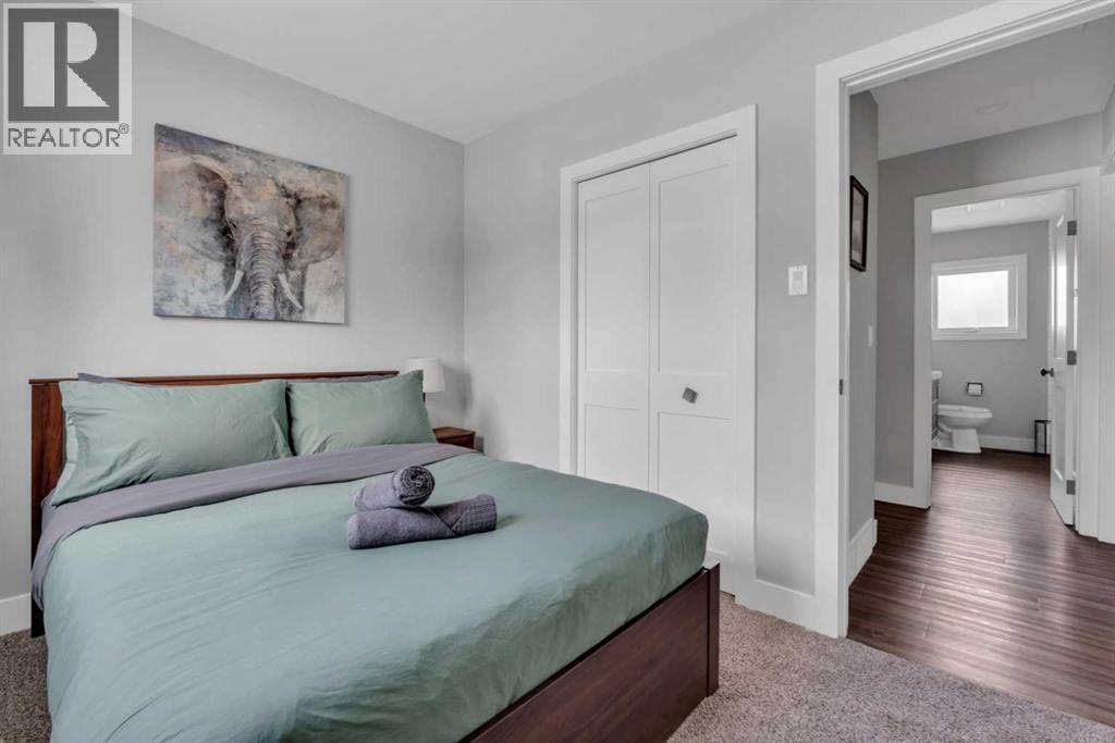 19 Garrick Drive Sw, Calgary, AB - Indoor Photo Showing Bedroom