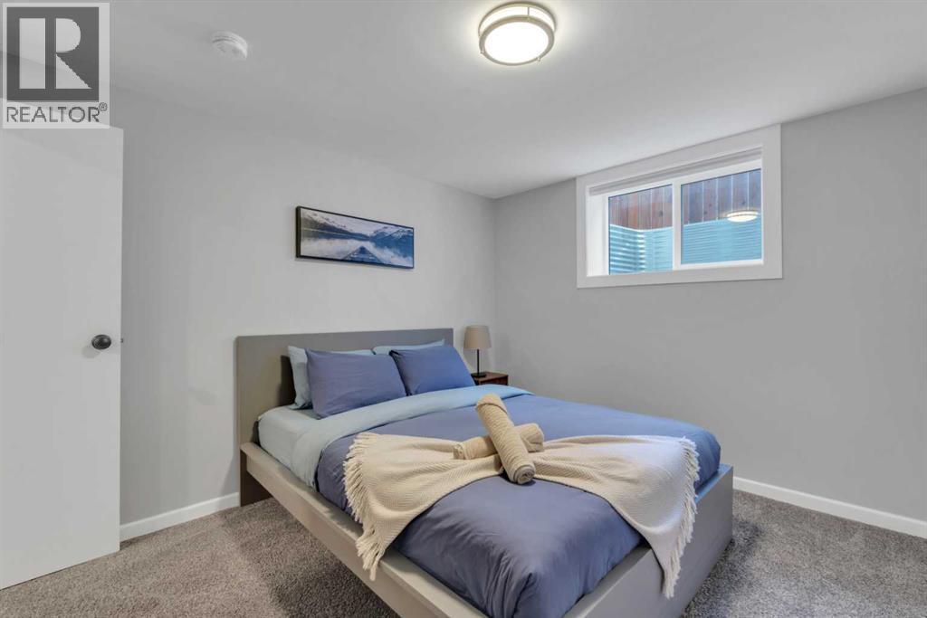 19 Garrick Drive Sw, Calgary, AB - Indoor Photo Showing Bedroom