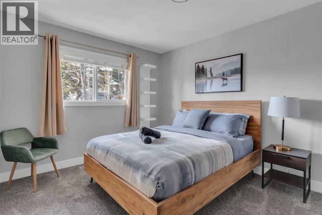 19 Garrick Drive Sw, Calgary, AB - Indoor Photo Showing Bedroom
