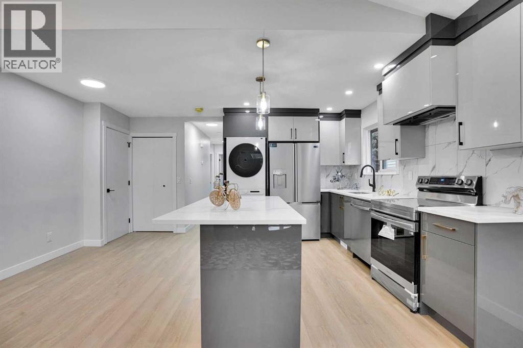 STAINLESS STEEL APPLIANCES - 23 Shawmeadows Place Sw, Calgary, AB - Indoor Photo Showing Kitchen