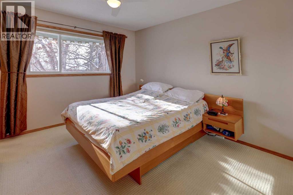 Primary Bedroom - 5943 Silver Ridge Drive Nw, Calgary, AB - Indoor Photo Showing Bedroom