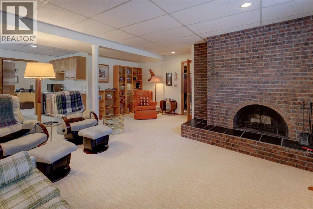5943 Silver Ridge Drive Nw, Calgary, AB - Indoor Photo Showing Living Room With Fireplace