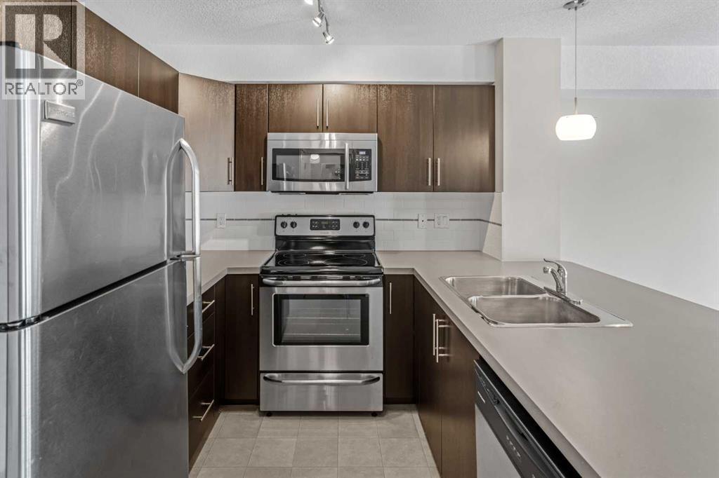 304, 2300 Evanston Square Nw, Calgary, AB - Indoor Photo Showing Kitchen With Double Sink