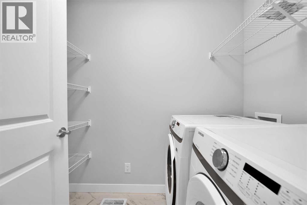 349 Calhoun Common Ne, Calgary, AB - Indoor Photo Showing Laundry Room