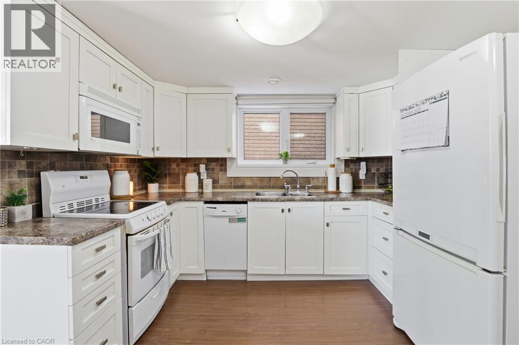25 Delena Avenue N, Hamilton, ON - Indoor Photo Showing Kitchen With Double Sink