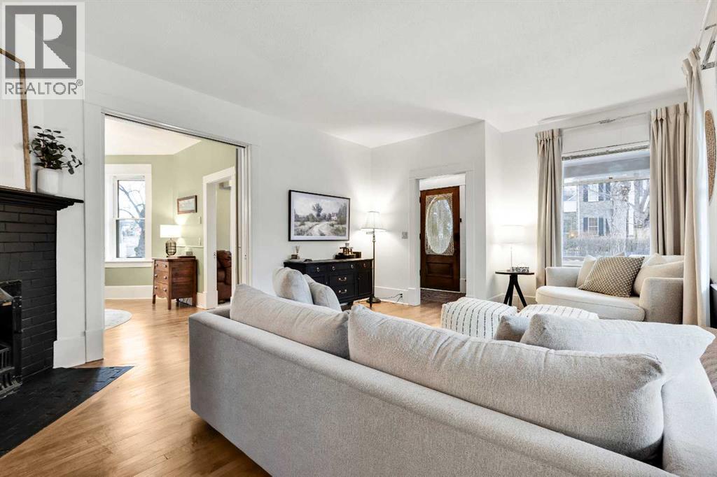 725 Macleod Trail Sw, High River, AB - Indoor Photo Showing Living Room With Fireplace