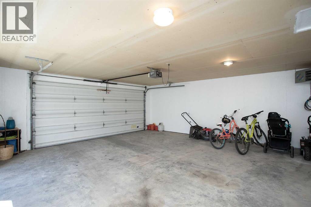 34 Bruns Bay, Lacombe, AB - Indoor Photo Showing Garage