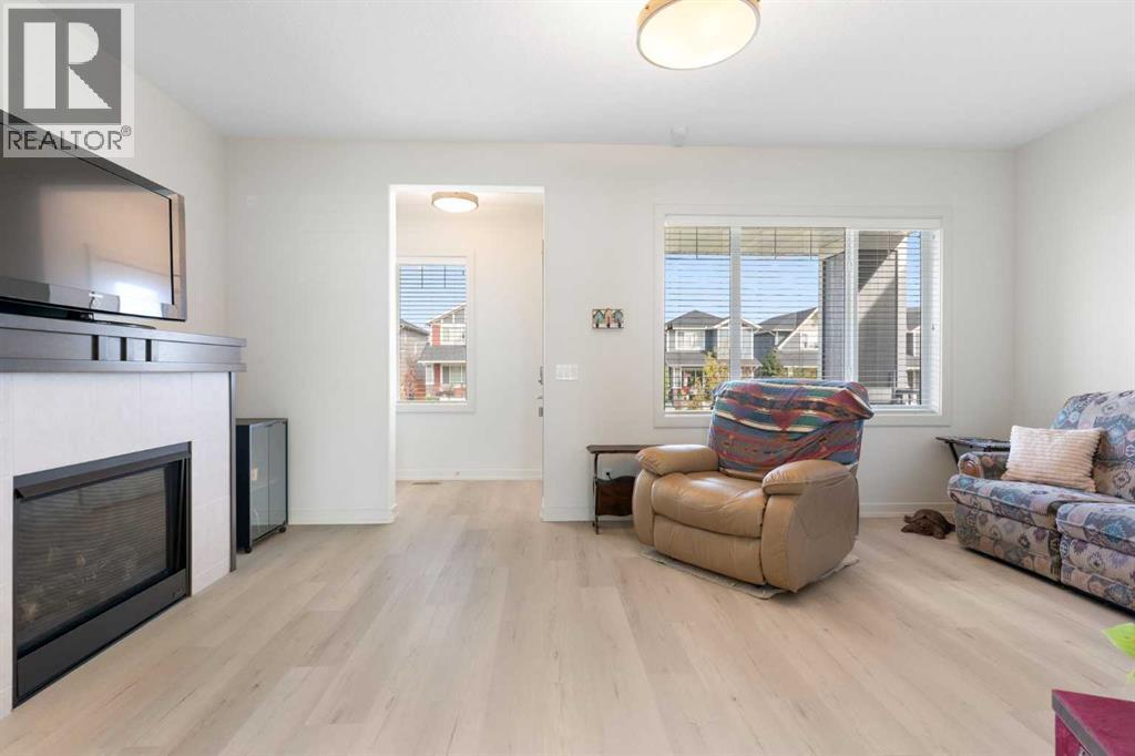 167 Fireside Drive, Cochrane, AB - Indoor Photo Showing Living Room With Fireplace
