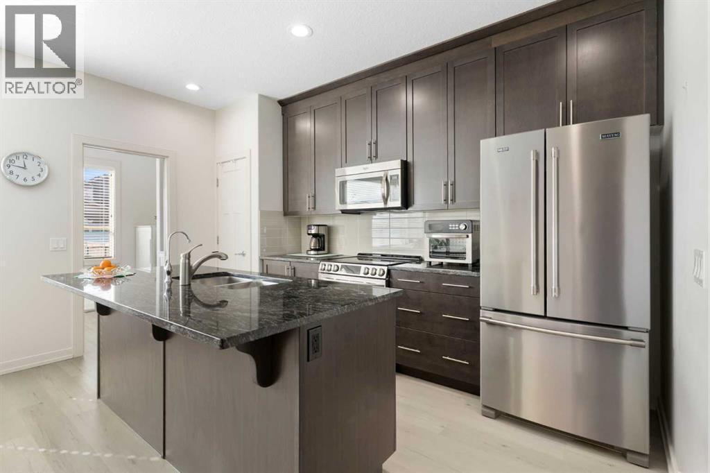 167 Fireside Drive, Cochrane, AB - Indoor Photo Showing Kitchen With Stainless Steel Kitchen With Upgraded Kitchen