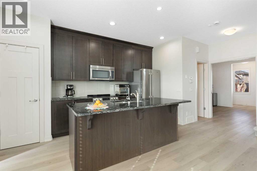 167 Fireside Drive, Cochrane, AB - Indoor Photo Showing Kitchen With Stainless Steel Kitchen With Upgraded Kitchen