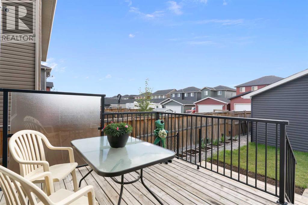 167 Fireside Drive, Cochrane, AB - Outdoor With Deck Patio Veranda With Exterior