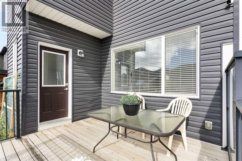 167 Fireside Drive, Cochrane, AB - Outdoor With Deck Patio Veranda With Exterior