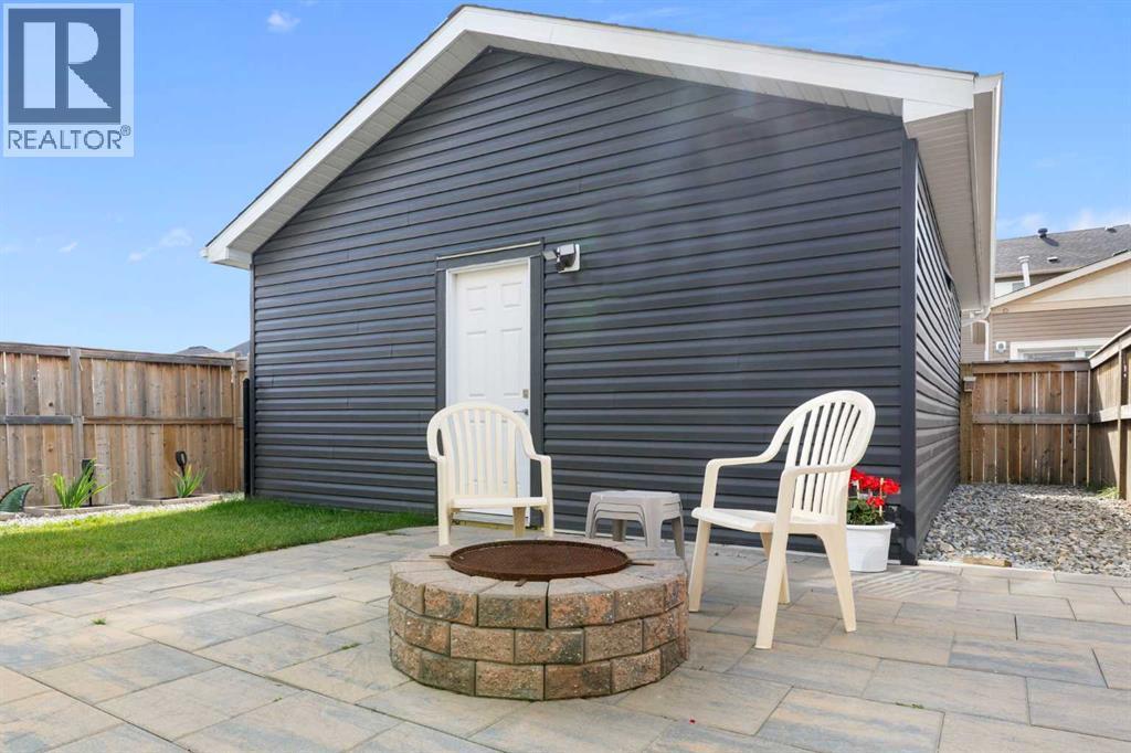 167 Fireside Drive, Cochrane, AB - Outdoor With Deck Patio Veranda With Exterior
